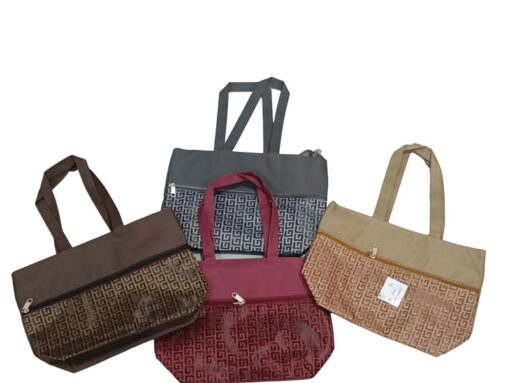 Printed tote is shown in brown, maroon, blue, and beige color.