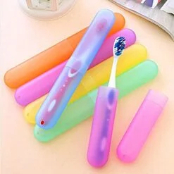 plastic toothbrush cover is presented in orange, purple, yellow, green, and blue color