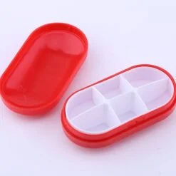 6 Compartment Red color travel pill case.