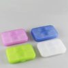 Travel pill case is shown in purple, green, blue, and white color.