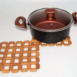 Bamboo placemat is being used to keep vessel.