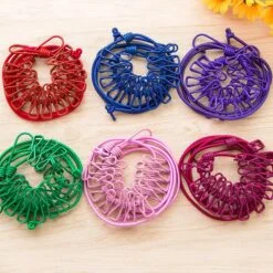 Cloth drying rope with hook is presented in 6 different colors.