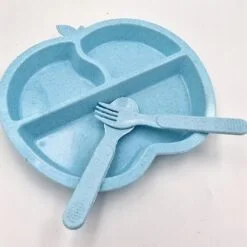 Blue color apple shaped plates with fork and spoon.