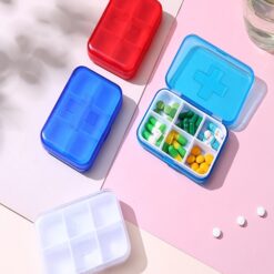 Light blue color travel pill case is open and rest all three travel pill case are closed.