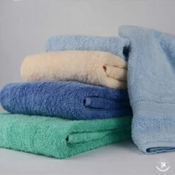 6 Different color microfiber kitchen towels are kept one upon another.
