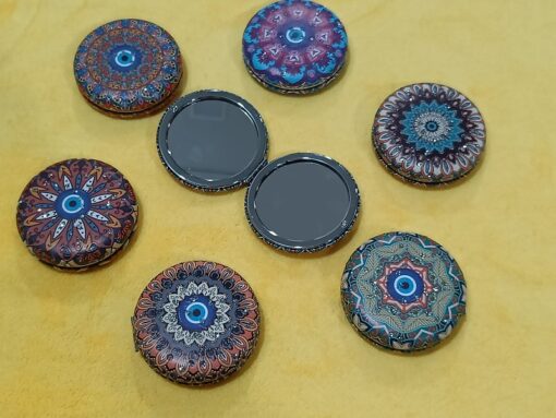 Round Shape travel pocket mirror is shown in different color combination and patterns