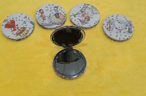 4 round travel pocket mirror is closed and all the patterns on it are shown. 1 travel pocket mirror is wide open.