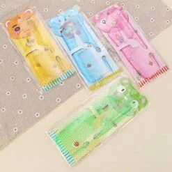 4 Baby hair brush and comb sets are shown in different colors.