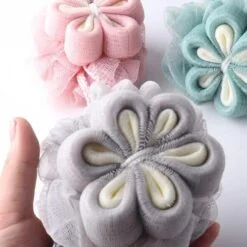 Flower Design shower loofa is presented in 3 different colors.
