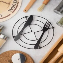 Knife & Fork Design black color coaster for pots and pans.