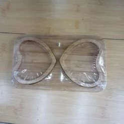 Heart shape wooden cup tray is placed on a table.