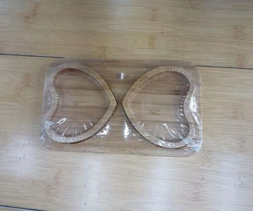 Heart shape wooden cup tray is placed on a table.