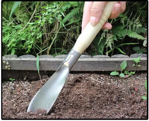 Pointed gardening shovel is being used in gardening.
