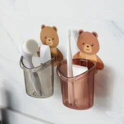 Bear toothbrush holder is shown in grey and brown color.