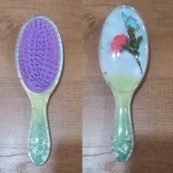 Cushion paddle hair brush is shown from front and back side both.