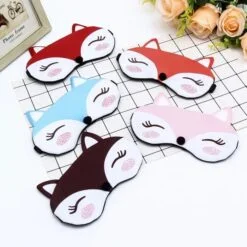Reusable gel eye mask is presented on a white table in 5 different color combinations.