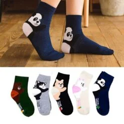 A girl is wearing panda cotton crew socks. Few different designs and colors panda cotton crew socks are also shown.