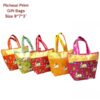 Printed hand bag is shown in pink, yellow, red, green, and orange color