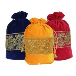 Velvet potli purse is presented in mustard yellow, navy blue, and magenta color
