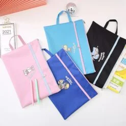 A4 size document bag is shown in pink, navy blue, sky blue, and black color on a white table.