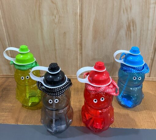Fancy water bottle with straw is presented on a desk in green, blue, red, and black color.