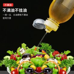 Woman is using plastic oil dispenser bottle while seasoning salad.