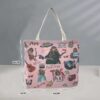 Pink color washable shopping bag with silver handle.