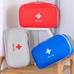 First aid medical bag is shown in grey, red, and blue color
