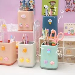 Square shape cute pen cup holder shown in 5 different colors.