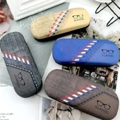 Denim glasses case is shown in navy blue, coffee, blue, and cream color.