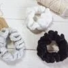 Cotton hair scrunchie in grey, white, and black color.