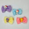 Kitty hair pin is presented in purple, blue, yellow, and pink color.