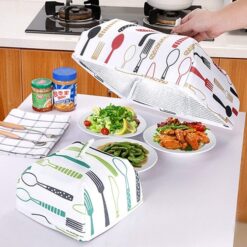 Woman is covering cooked meals on dining table with the help of foldable insulated food cover