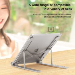 Laptop is mounted on an adjustable aluminum laptop stand