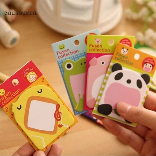4 different color and shape animal sticky notes are held by a working woman.