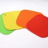Green, yellow, orange, and red color hot pot mats are presented.
