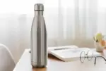 A 1000 ml HomeJoy Hot & Cold Cola Bottle with a leak-proof design, displayed in a prominent color