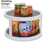 The double-layer rotating tray filled with various kitchen items on both tiers, showcasing its storage capacity.