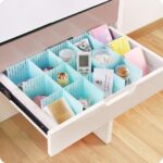 Open kitchen drawer with utensils and cookware neatly organized using the drawer organizer & dividers.