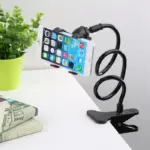 A close-up view of the lazy bracket mobile phone stand, highlighting the adjustable joints, secure phone holder, and sturdy base.