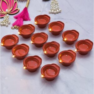 Water LED Sensor Diya in Use Mesmerizing Ambiance: Water LED Sensor Diyas in Action A cluster of colorful Water LED Sensor Diyas floating in a bowl of water, illuminating the water with a soft glow. Much less price compare to Amazon & Meesho