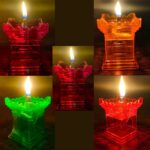 Enchanting Glow: Tulsi Vrindavan Reflection Diya Lit A lit Tulsi Vrindavan Reflection Diya with a warm glow illuminating the intricate design and creating a mesmerizing reflection on the surface.