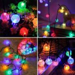 A strand of 14-LED Crystal Mini Globe String Light (Multicolour) draped across a gazebo, casting a playful and vibrant cascade of colored light.