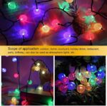 A strand of 14-LED Crystal Mini Globe String Light (Multicolour) illuminated, showcasing cascading crystal globes glowing in vibrant hues, casting a mesmerizing display of colorful light.