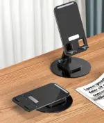 A 360° Rotating Foldable Mobile Phone Stand holding a smartphone in landscape mode, showcasing its adjustable viewing angle and non-slip base.