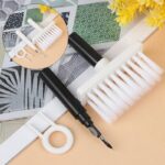 5-in-1 Multifunctional Cleaning Brush A compact 5-in-1 cleaning brush featuring a high-density brush, flocking sponge, metal pen tip, nylon bristles, and a keycap puller, all conveniently stored in one handle.