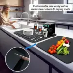 A variety of dishes, glassware, and utensils drying on a water-absorbent kitchen drying mat. The countertop is dry and free of puddles.