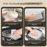 A person using a dishwashing cloth to wipe down a stainless steel countertop in the kitchen.