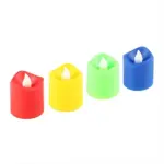 Four smokeless candles displayed on a shelf alongside decorative items, creating a warm and inviting atmosphere