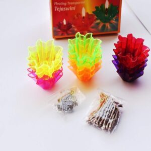 Celebrate with Light: Reflection Plastic Diyas for Diwali & Festivals A group of colorful Reflection Plastic Diyas lit with tealight candles, casting a warm and festive glow on a decorated surface. At low prices as compare to Amazon.